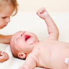 10 Weird Things Toddlers Do with a New Baby