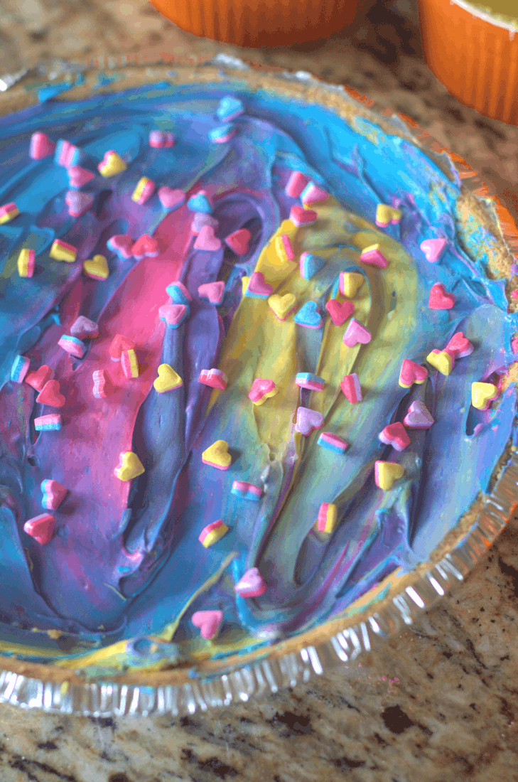 A freaking fantasy come true. Unicorn Cheesecake. One slice of this amazing brightly-colored no-bake cheesecake of tastiness will have you pooping rainbows just like your favorite mythical creature. No really--it's gorgeous. Just not really an every-day treat. #nerdymammablog #unicornfood #unicorncheesecake #nobakecheesecake #fantasyfood #funfood #havingfunwithfood #unicorn #tasty #cheesecake #cheese #cake #ridiculous