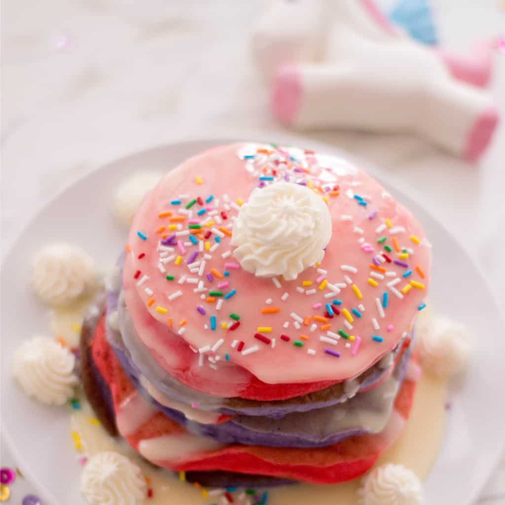 I love a cute and silly recipe. But one that tastes as cute and amazing as it looks? That, my friends, that is worth the ultimate name: Unicorn Pancakes. Dude, if you don't make these at least once in your life, you're crazy.