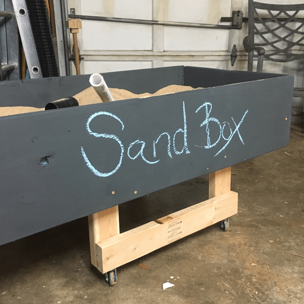  I needed a way to keep my kids occupied while I worked in the workshop. But i really didn't want to put a TV in there. So, I figured out How to Make a Rolling Sensory Table (Sand Box - It's a Rolling Sandbox). Enjoy. #nerdymammablog #sensorytable