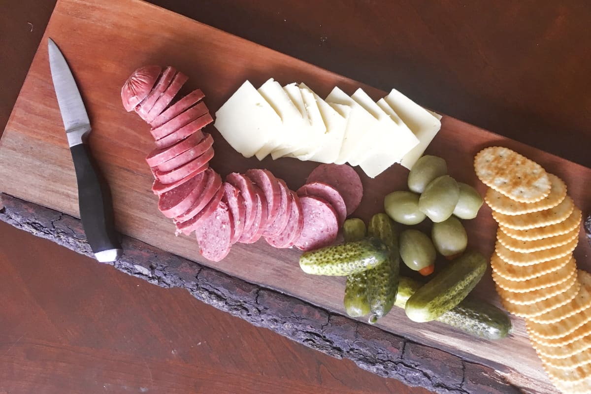 I needed a flat place on my ottoman to put a cup of coffee. So I figured out How to Make a Live Edge Charcuterie Tray, so I also have an awesome "small things" food tray! #nerdymammablog #diy #charcuterie