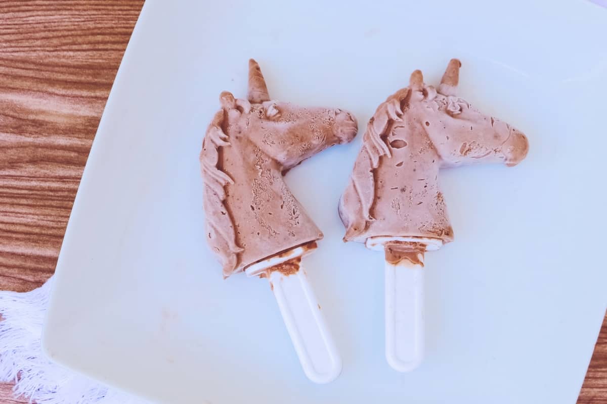 I have to admit, I'm not always a fan of chocolate. But when I made these Ridiculously Chocolatey Unicorn Pudding Pops, I couldn't get enough! #unicorn #puddingpop #unicornpuddingpop #sumemrtreat #popsicle #nerdymammablog