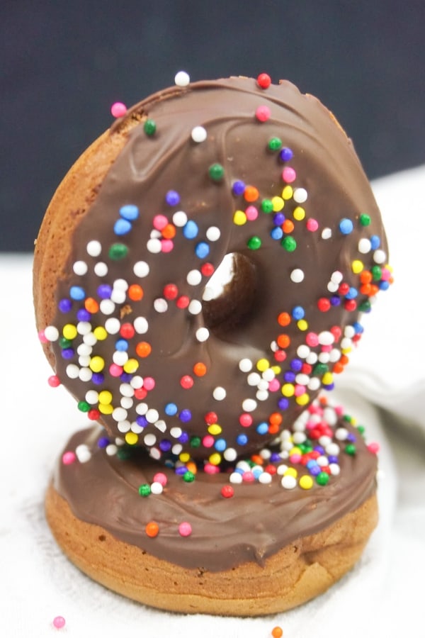 Oh, how I love a good donut. But, with our dietary restrictions, coming by one that's good--not always easy. So I made these Vegan Chocolate Cake Donuts that are so flavorful and fun, it's better than hitting the donut store! #nerdymammablog #vegan #vegandonut #vegandonutrecipe #donutrecipe