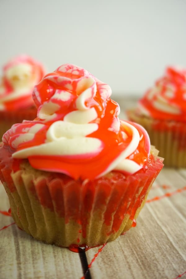 Despite the fact that's its summer, I'm making Bloody Cupcakes because I just really miss Halloween. Using fake edible blood, a yummy cupcake and a spoon, I think I succeeded nicely! #nerdymammablog #halloweencupcakes #bloodycupcakes #halloweencupcakerecipe