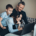 happy family watching online movies on the laptop