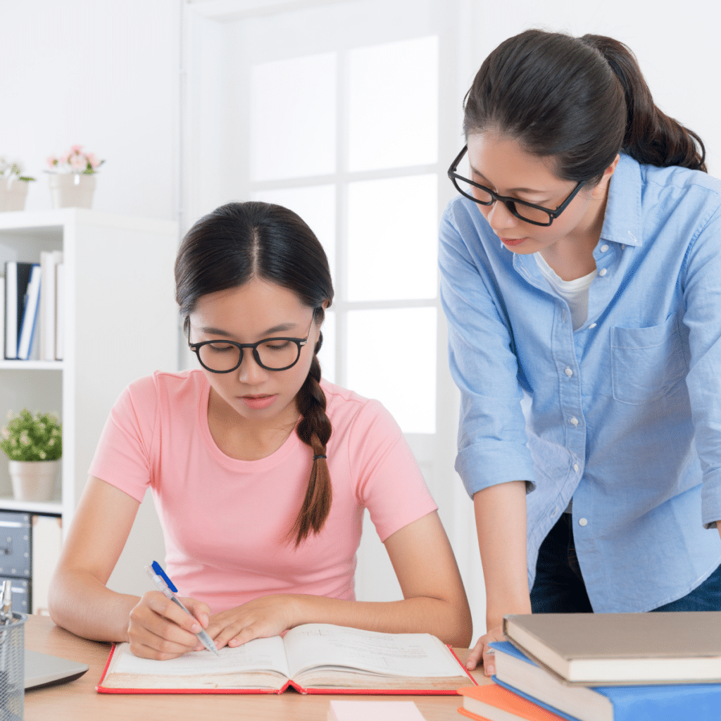 college student doing school homework having problem and asking her mother to help her solve the problem