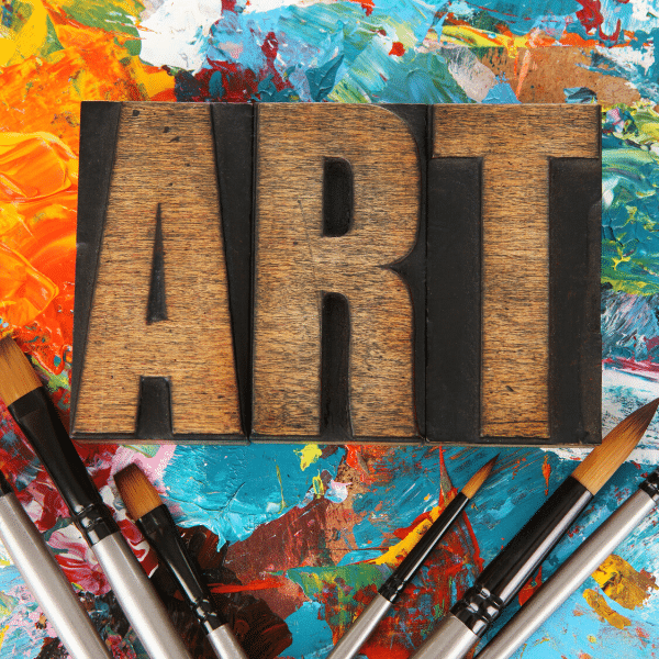 Art spelled out with vintage letterpress against a pallette in the background.