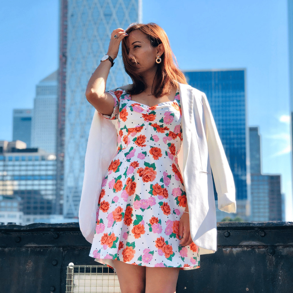 A girl in the city wearing a floral dress