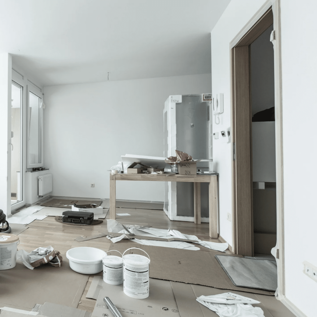 Home renovation in room full of painting tools