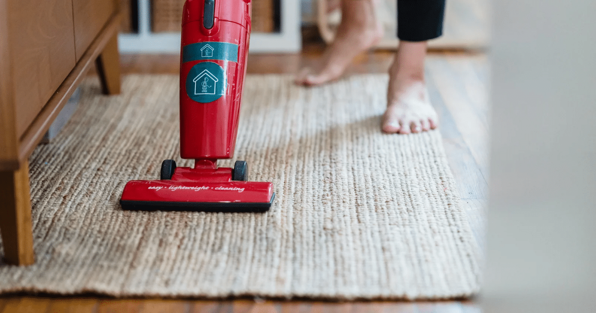 A red vacuum cleaning in the carpet