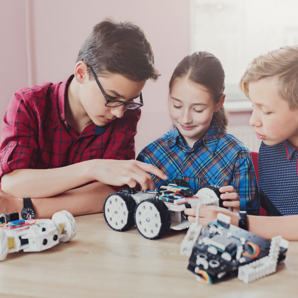 Children creating robots at school stem education, copy space. Early development, diy, innovation