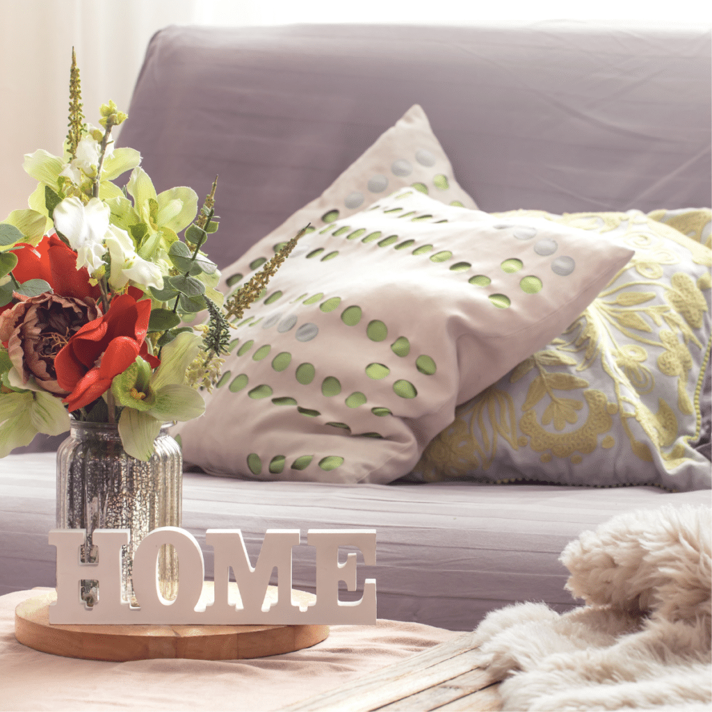 Homely cozy spring interior in the living room with a vase and flowers, home comfort concept