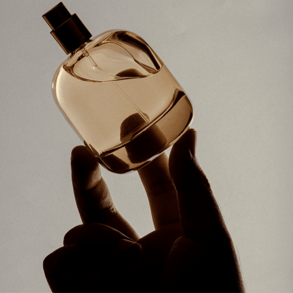 A silhouette photo of a soft and grainy perfume