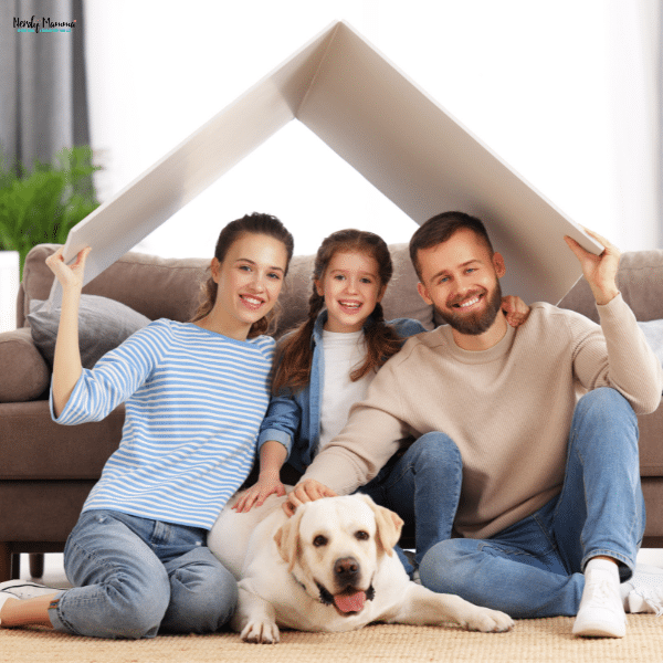 A smiling family with a child and dog sits under a roof-shaped panel, symbolizing home and security across life stages.