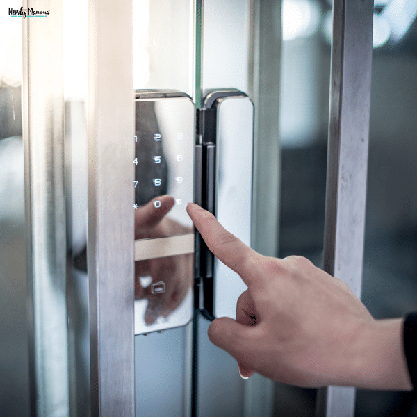 Person entering a code on a digital keypad lock, representing physical security strategies for new business owners protecting their workspace.