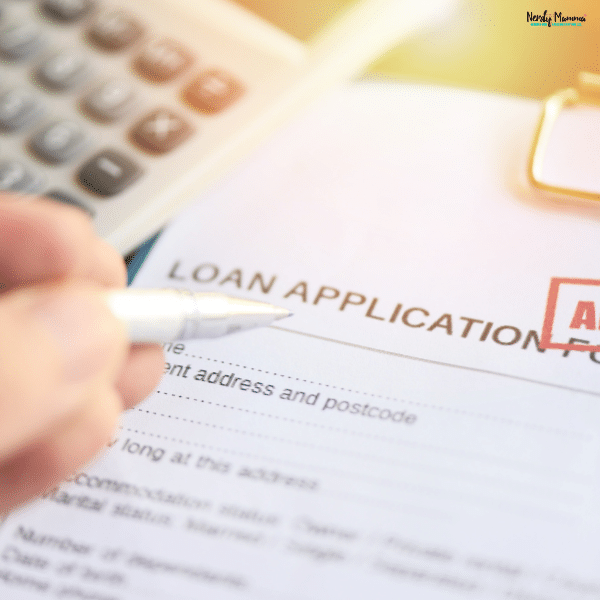 A person prepares to fill out a personal loan application form.