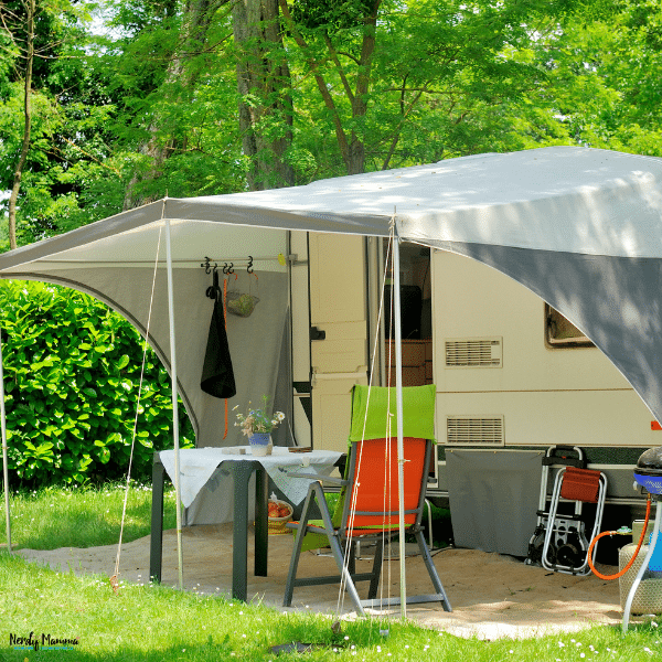 Caravan awning providing shaded outdoor living space beside a camper, demonstrating how a caravan awning expands comfort and usability while traveling.