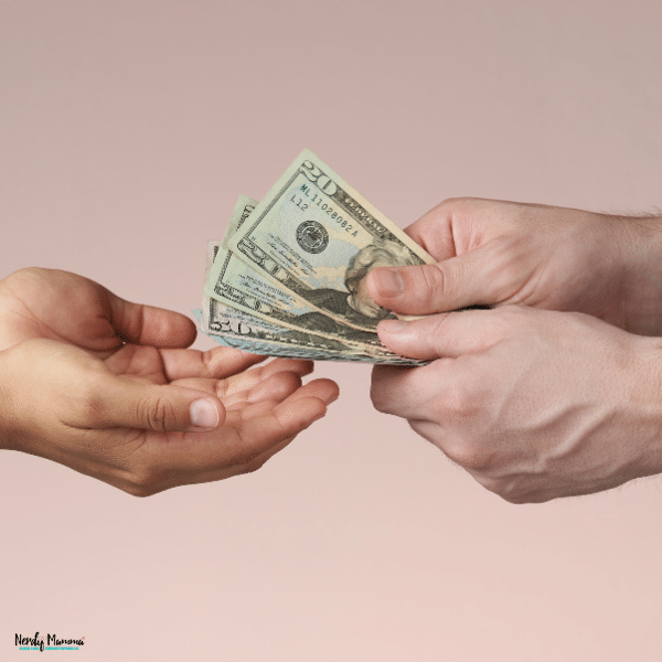 Hands exchanging cash, representing freelance payments, client transactions, and managing overdue invoices.