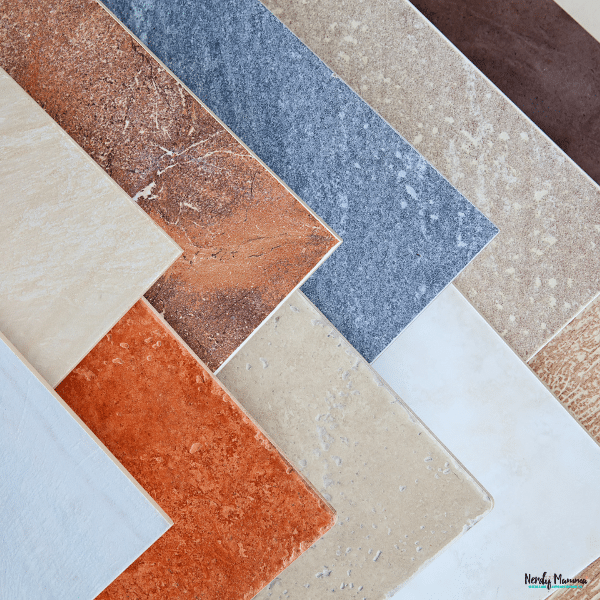 Assorted tile samples in different colors and textures, helping compare tile finishes for kitchens, bathrooms, and living spaces.