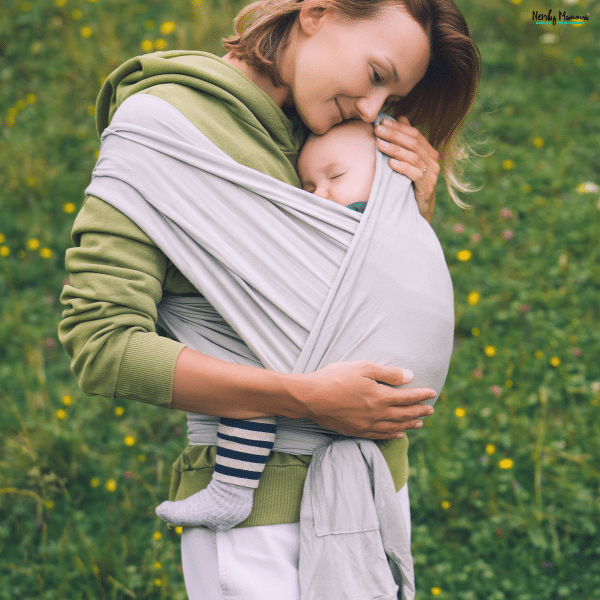 Babywearing with a soft wrap carrier allows a parent to keep an infant close while supporting comfort, bonding, and mobility.