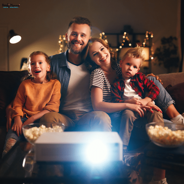 Parents and children gathered for a cozy movie night at home as part of a fun family weekend activity.