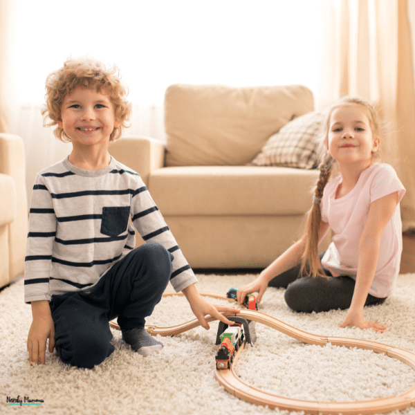 Children play safely on a soft carpet runner that provides a comfortable and stable surface in a family living room.