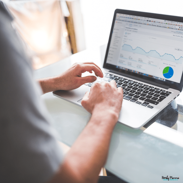 Professional analyzing business performance data on a laptop, representing the analytical skills gained through a business administration degree.