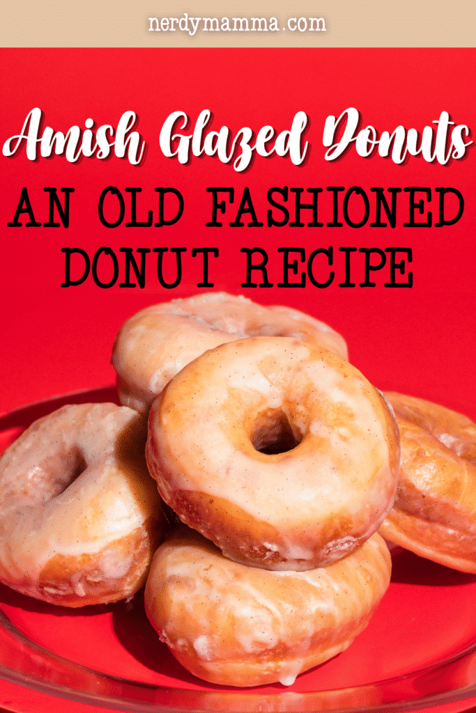 A stack of old-fashioned Amish glazed donuts features golden fried dough covered in a thick, sweet glaze.