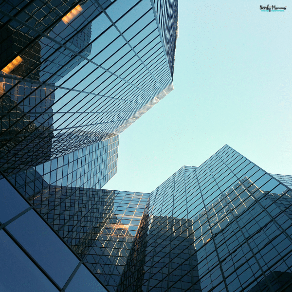 Modern office buildings with reflective glass symbolize the digital transformation shaping today's CEO search firms.
