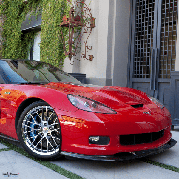 A red sports car parked outside highlights the exterior condition to inspect before buying a pre-owned ZR1.