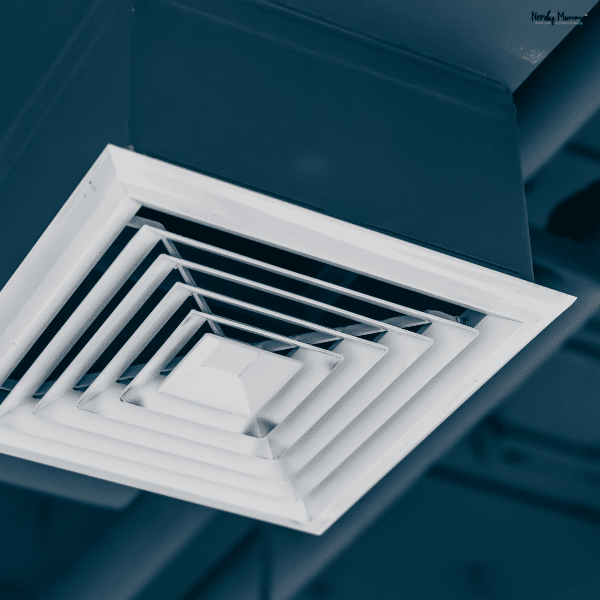 A white ceiling vent shows how a ducted heat pump delivers air through hidden ductwork.