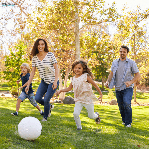 A sunny park offers one of many fun places for kids to play soccer with their family.