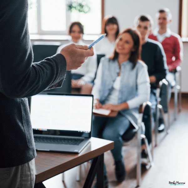 An instructor teaches seated learners in a classroom, illustrating skills training for a career change.