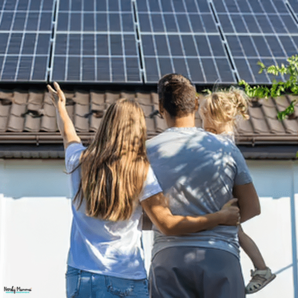 A family looks at rooftop solar panels that could pair with a solar battery for home energy storage.